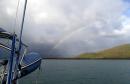 Island Head Creek: Near the end of our long stay, a shower passes through with rainbow.